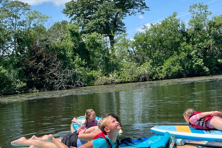 a group of people on a boat in the water