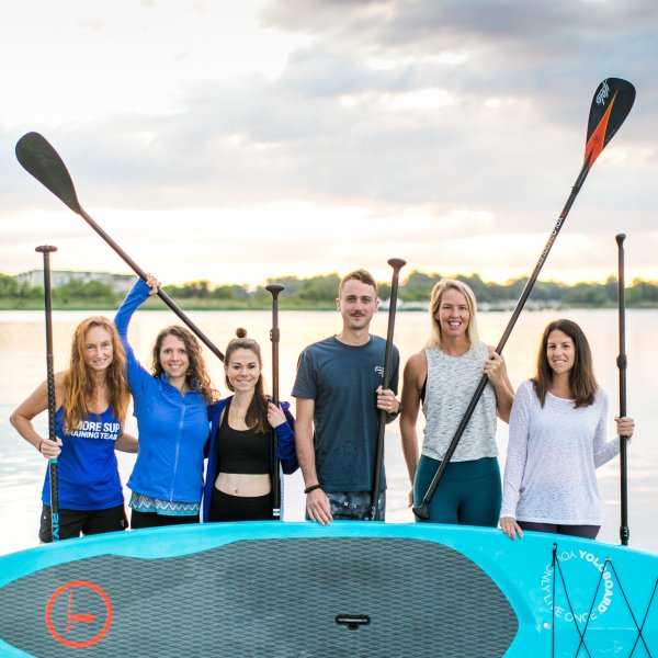 Group of stand up paddle board instructors