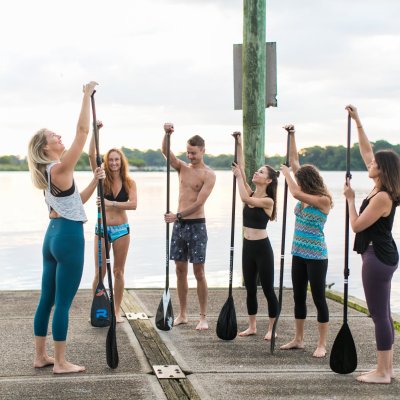 Group of people preparing to paddle