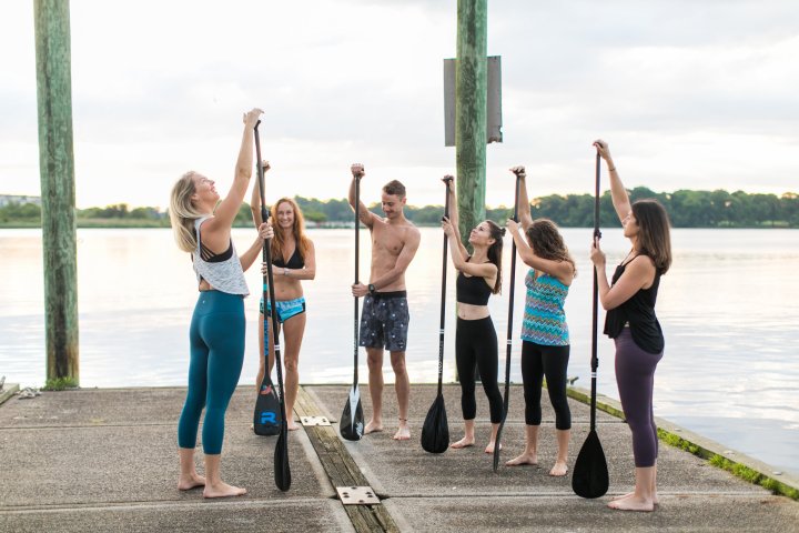 Group of people preparing to paddle