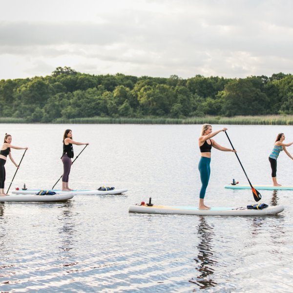 Group of people paddling in baltimore river