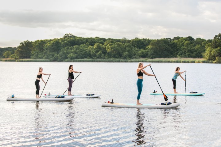 Group of people paddling in baltimore river