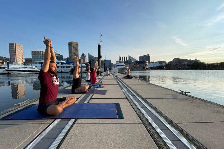 a person standing next to a body of water