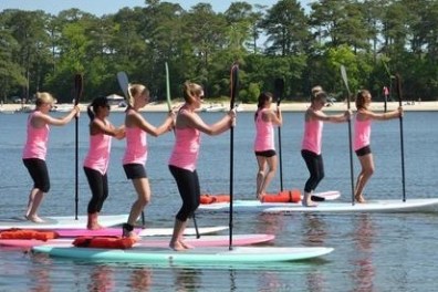 a group of people that are standing in the water
