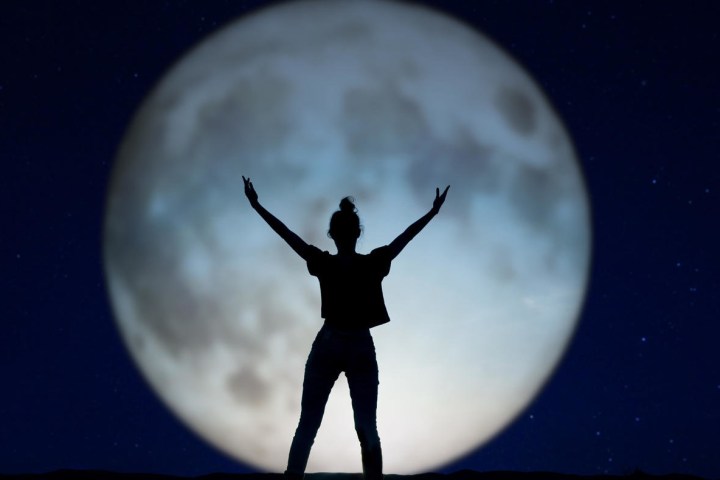 a person that is standing in the dark