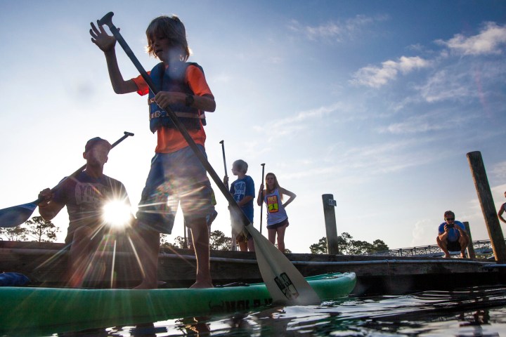 a group of people riding on the back of a boat