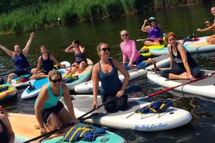 a group of people on a boat in the water