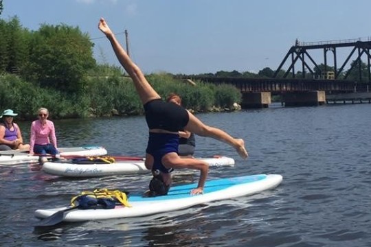 a man riding a surf board on a body of water