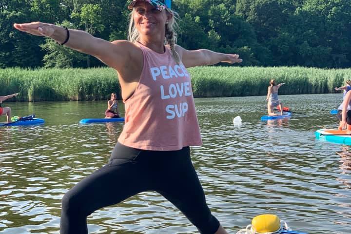 a person standing next to a body of water