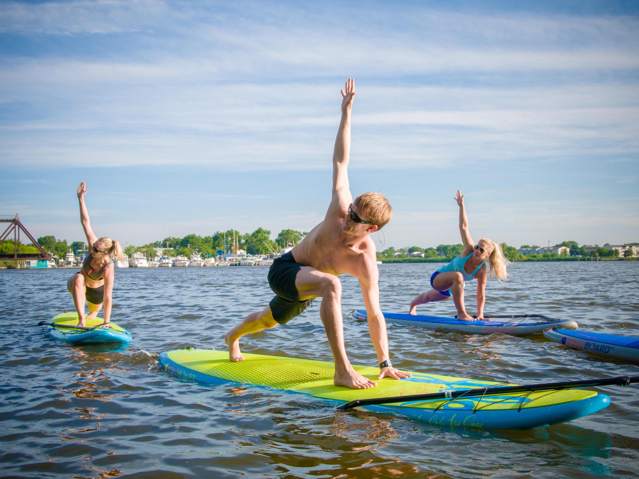 a young girl riding a wave on a surfboard in the water