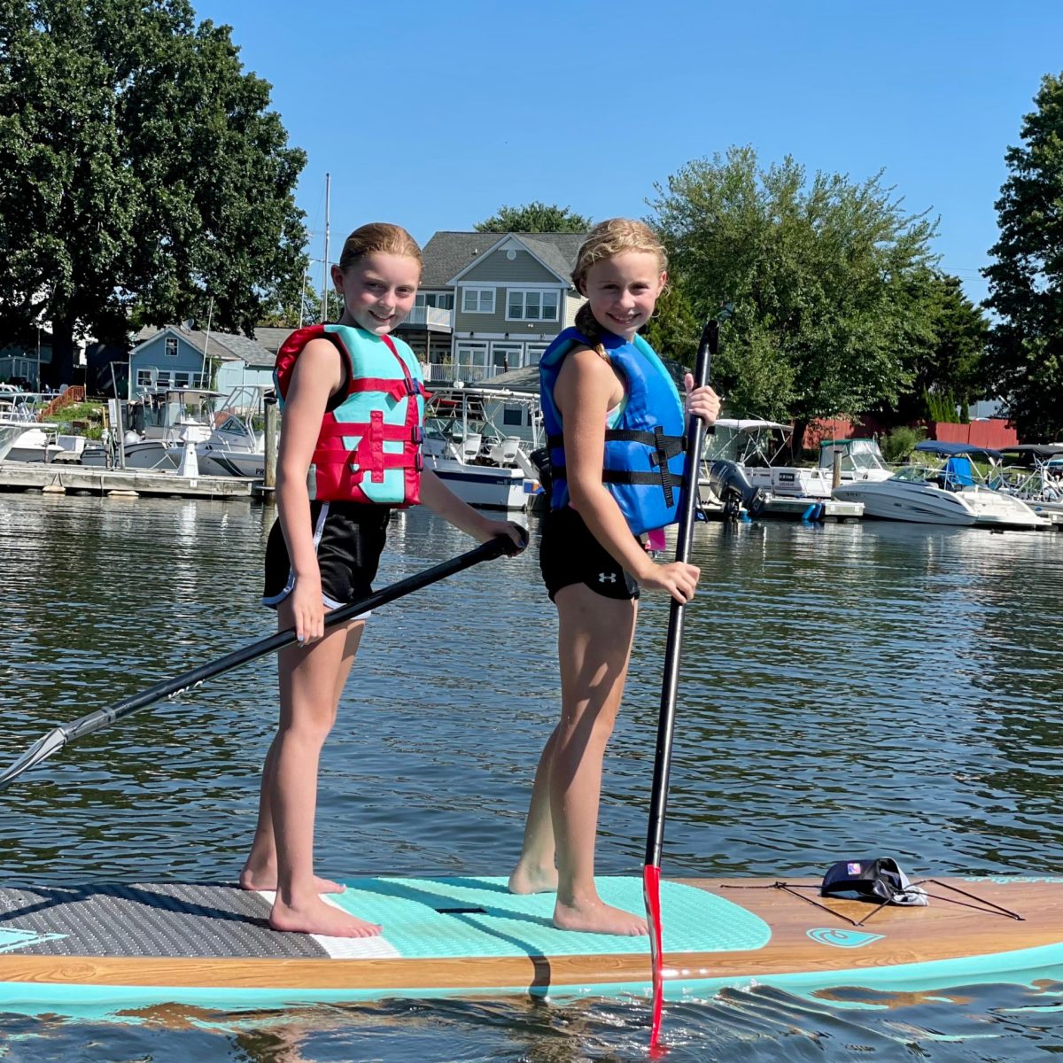 a couple of people that are standing in the water