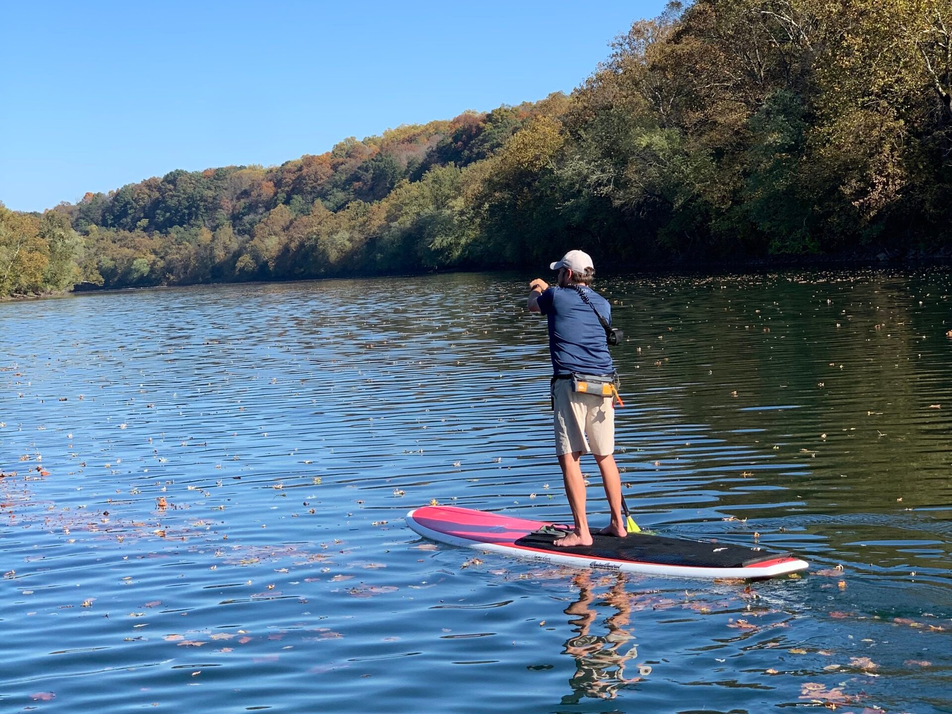 a man rowing a boat in the water