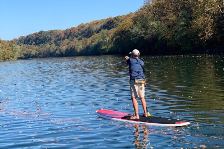 a man rowing a boat in the water