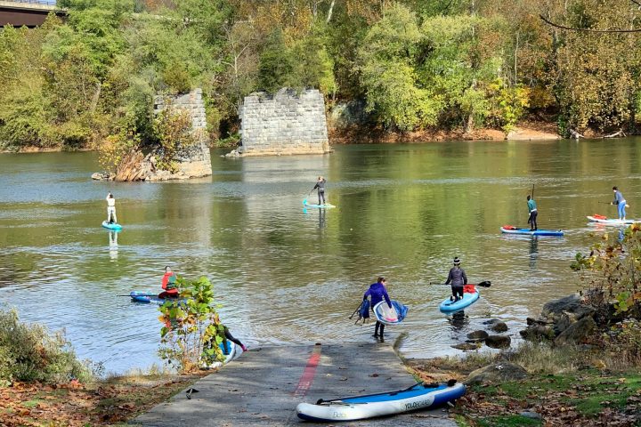 a group of people riding skis on a body of water