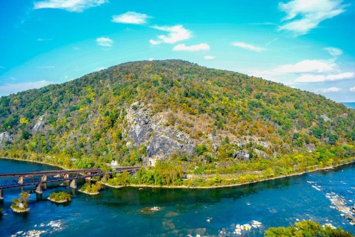 a body of water with a mountain in the background