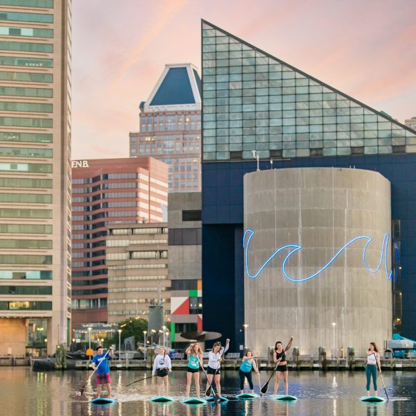 a building next to a body of water