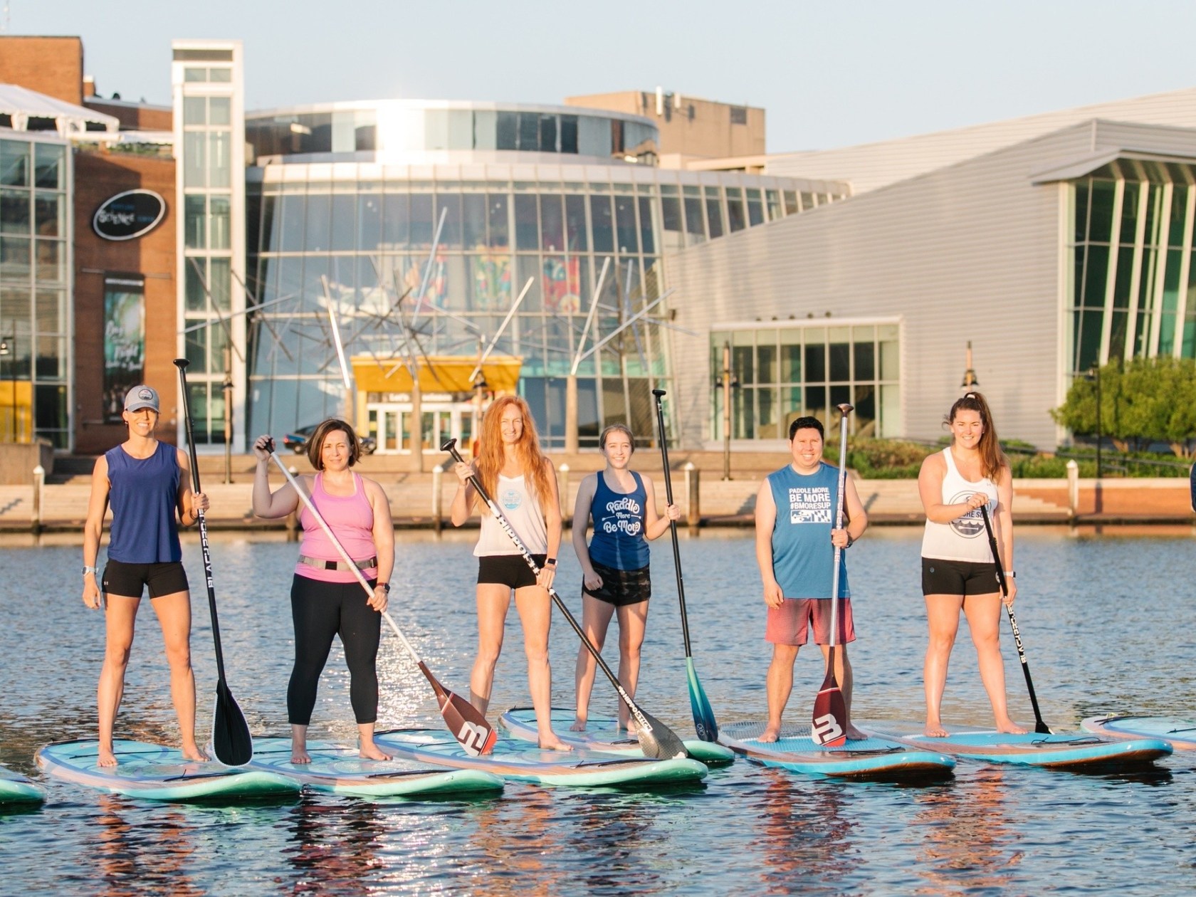 a group of people that are standing in the water