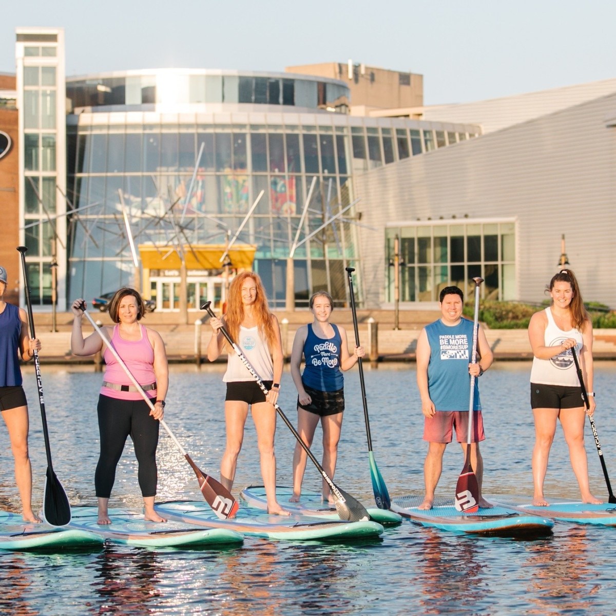 a group of people that are standing in the water