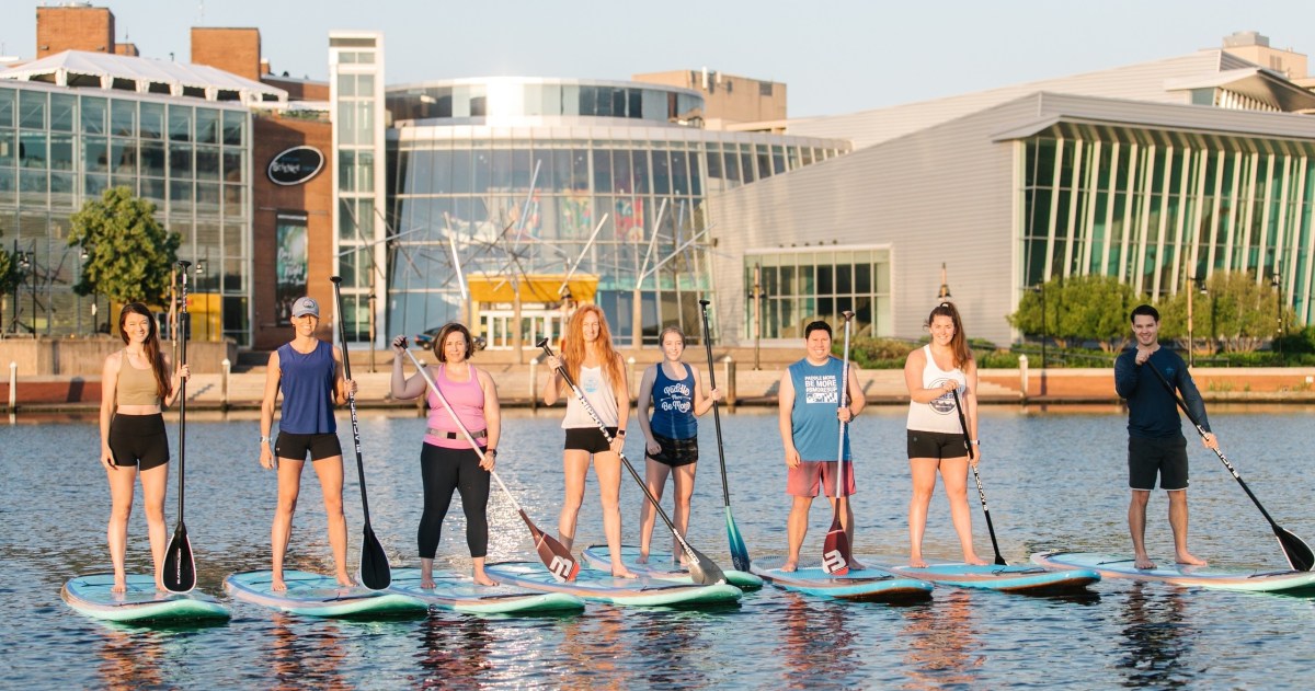 a group of people that are standing in the water